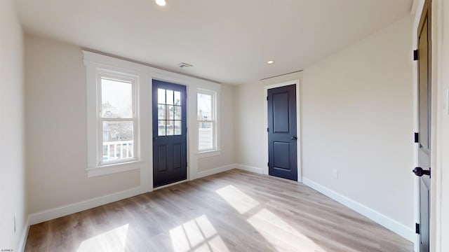 entryway with recessed lighting, visible vents, baseboards, and light wood-style floors