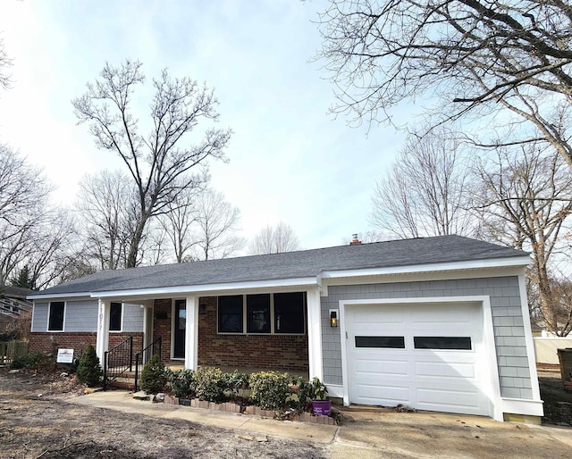 ranch-style home with covered porch, a chimney, concrete driveway, a garage, and brick siding