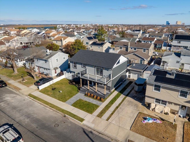 birds eye view of property with a residential view