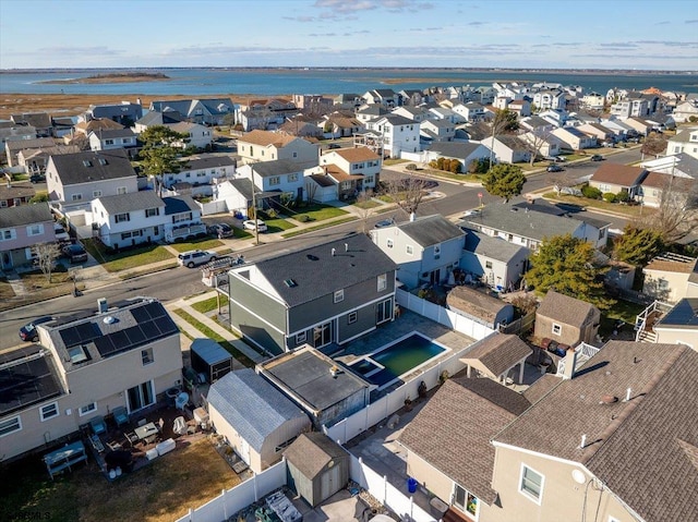 birds eye view of property with a residential view