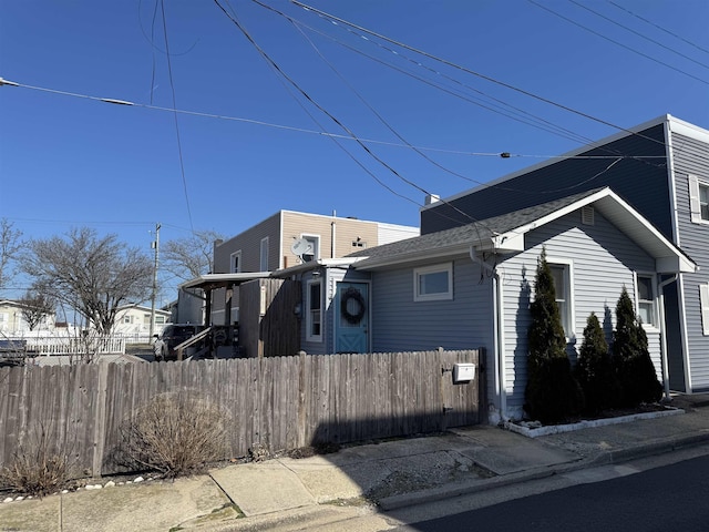 view of property exterior featuring fence