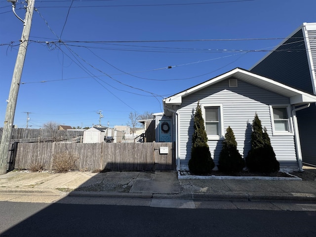 view of side of home featuring a fenced front yard