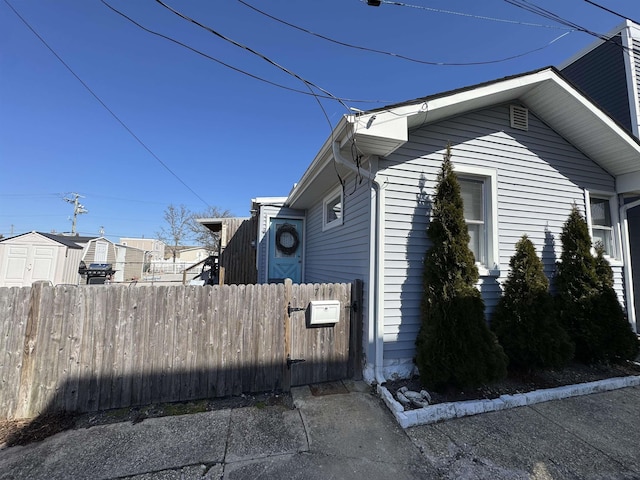 view of home's exterior with fence