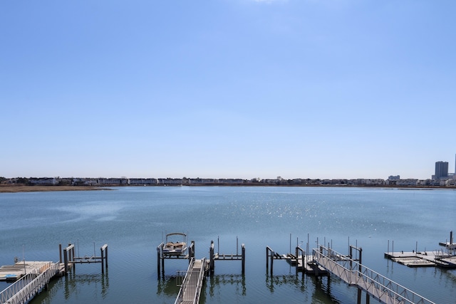 view of dock featuring a water view and boat lift