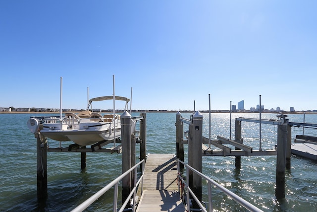 dock area featuring a water view and boat lift