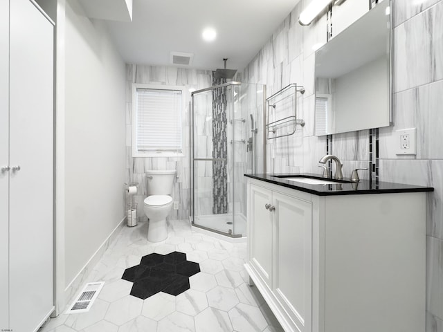 full bathroom with visible vents, vanity, toilet, and a shower stall