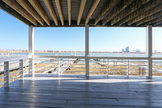 wooden deck with a city view and a water view