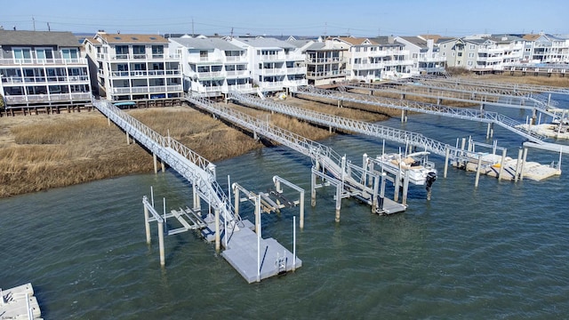 dock area with a water view and boat lift