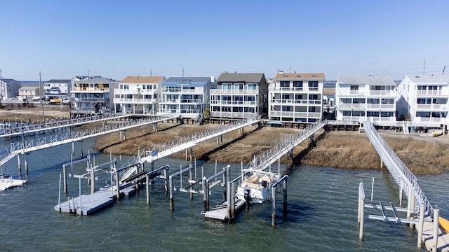 dock area with boat lift and a water view