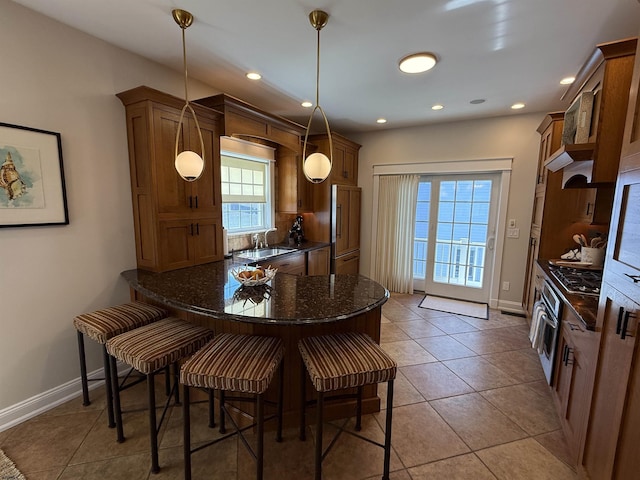 interior space with light tile patterned floors, baseboards, and recessed lighting