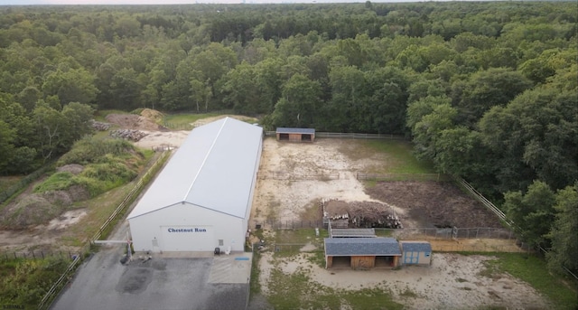 bird's eye view featuring a wooded view