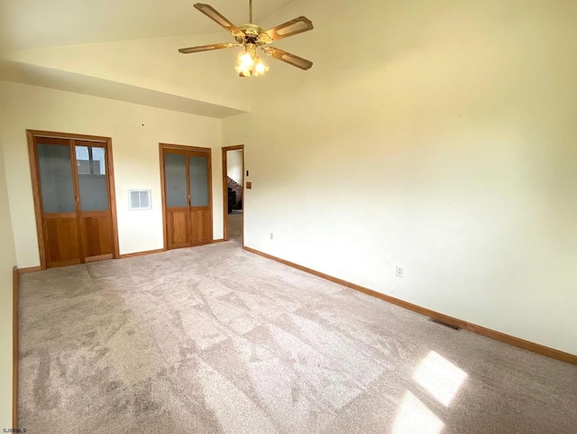 empty room with visible vents, ceiling fan, baseboards, and carpet