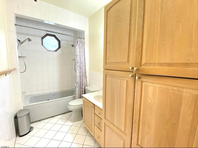 full bath featuring shower / bath combo with shower curtain, toilet, tile walls, tile patterned flooring, and vanity