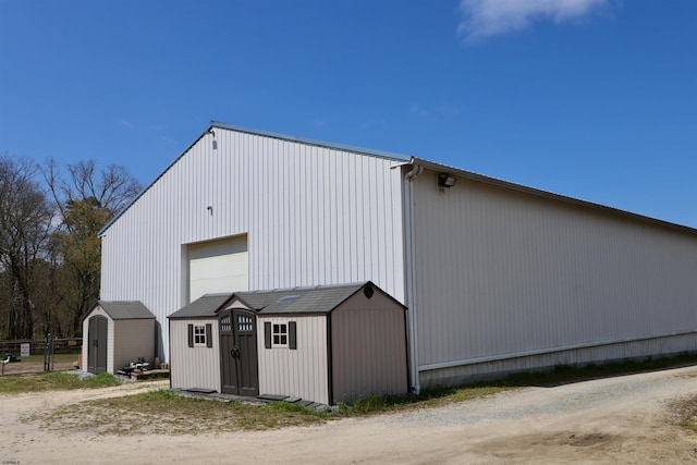 view of shed featuring fence