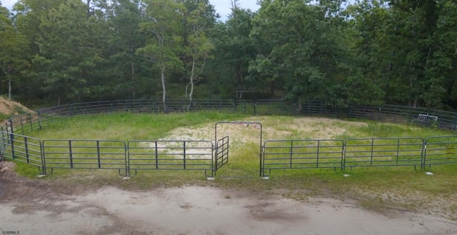 view of horse barn featuring a rural view