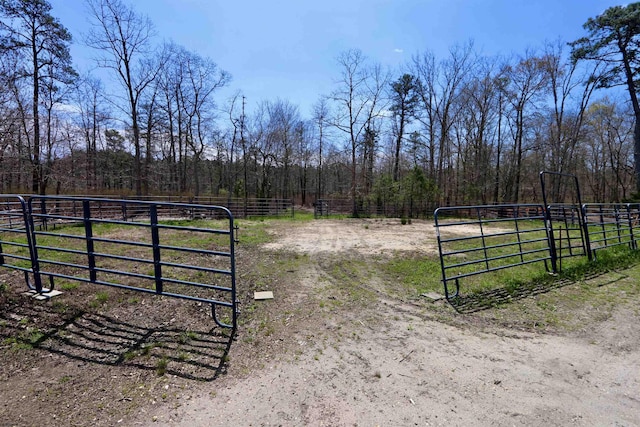 view of gate featuring fence