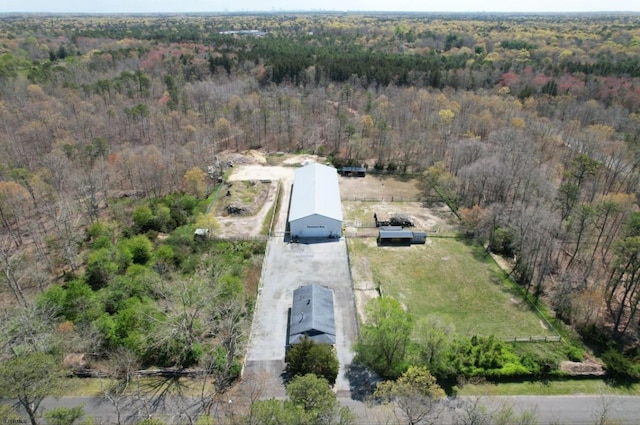 aerial view featuring a wooded view