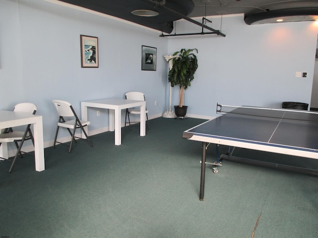 recreation room featuring baseboards and carpet floors