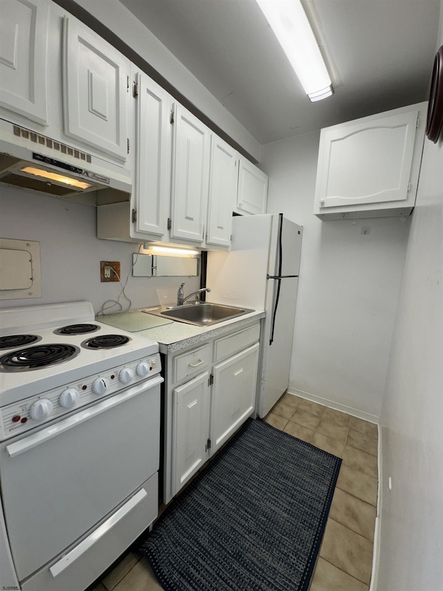 kitchen with white appliances, a sink, light countertops, white cabinets, and under cabinet range hood