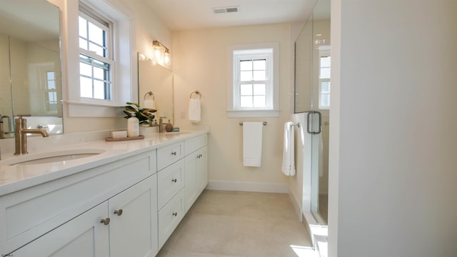 full bathroom featuring a sink, visible vents, a stall shower, and double vanity