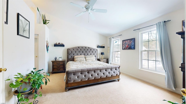 bedroom with baseboards, light colored carpet, a ceiling fan, and lofted ceiling