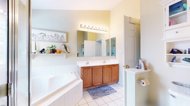 bathroom featuring a bath, toilet, tile patterned floors, and vanity