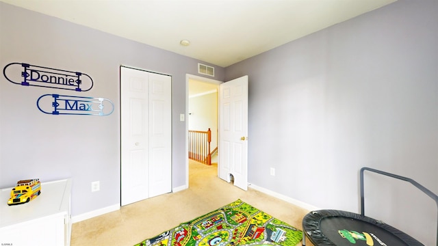 rec room featuring baseboards, visible vents, and carpet floors