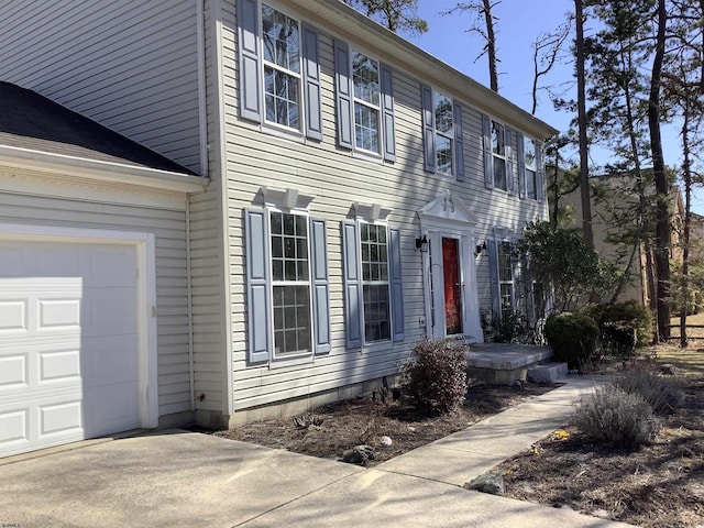 colonial home with a garage