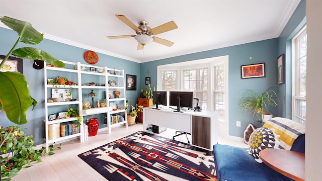 rec room featuring plenty of natural light, baseboards, crown molding, and a ceiling fan