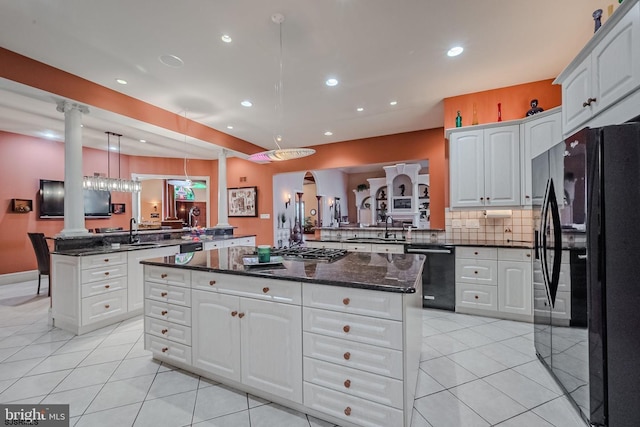 kitchen with black appliances, a sink, a kitchen island, a peninsula, and light tile patterned floors