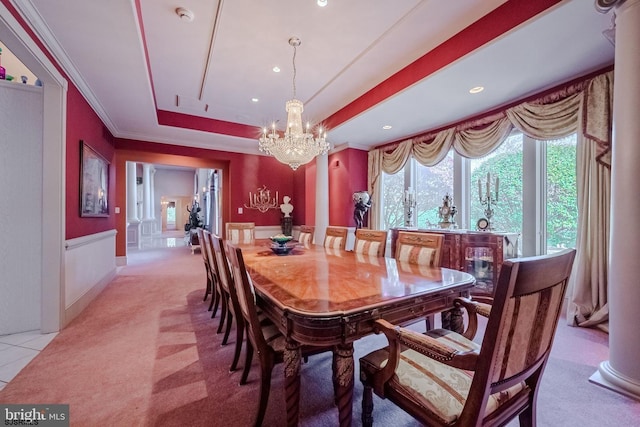 dining room with a raised ceiling, recessed lighting, crown molding, baseboards, and a chandelier