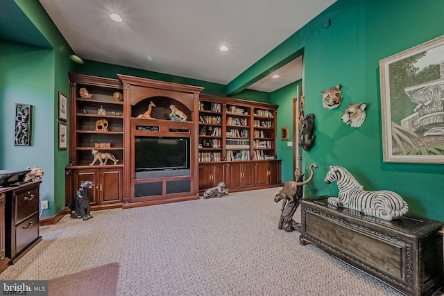 living area featuring recessed lighting, beam ceiling, and carpet