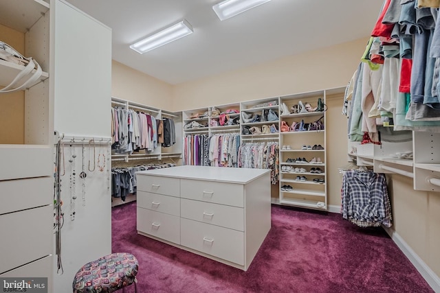 spacious closet featuring dark carpet