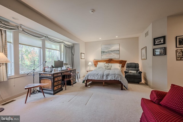 carpeted bedroom with recessed lighting, visible vents, and baseboards