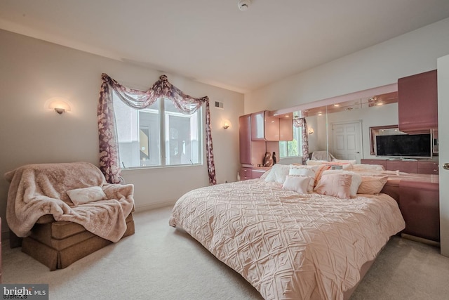 carpeted bedroom with visible vents