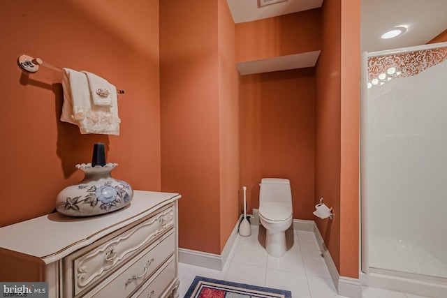 bathroom with visible vents, baseboards, toilet, a stall shower, and tile patterned floors