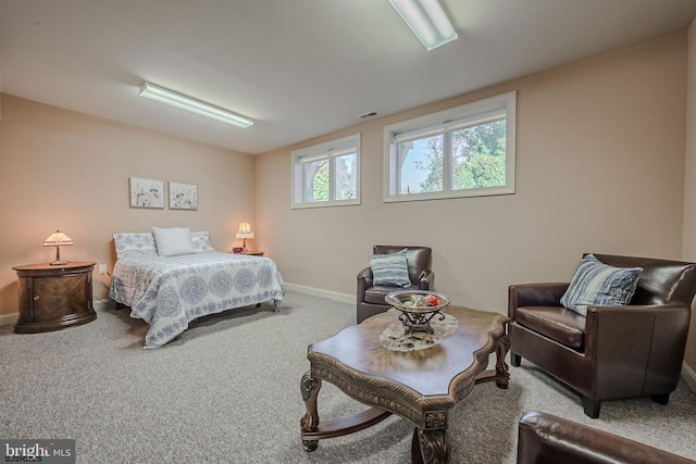 carpeted bedroom with baseboards and visible vents