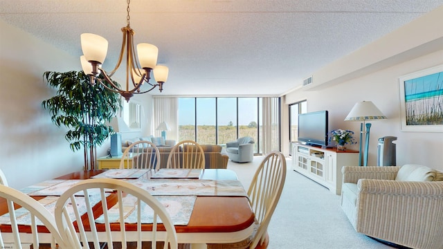 dining area featuring a textured ceiling, floor to ceiling windows, visible vents, and light carpet