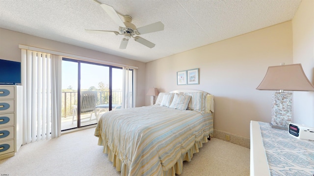 bedroom with light carpet, a textured ceiling, a ceiling fan, and access to outside