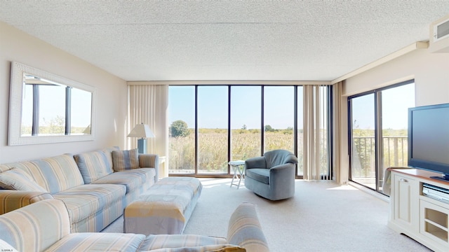 living area featuring a wall of windows, light colored carpet, and a textured ceiling