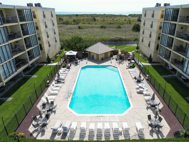 pool with a gazebo, a patio, and fence