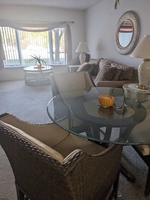 view of carpeted dining area