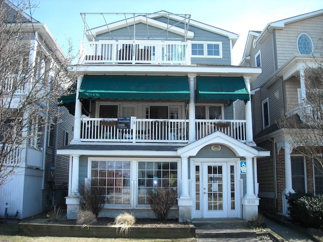 view of front of home with a balcony