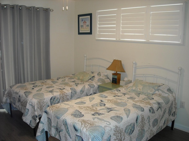 bedroom with wood finished floors