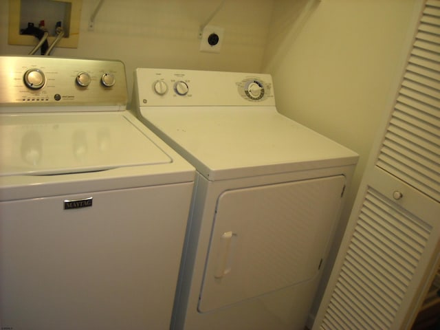 washroom featuring independent washer and dryer and laundry area