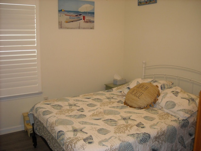 bedroom with wood finished floors