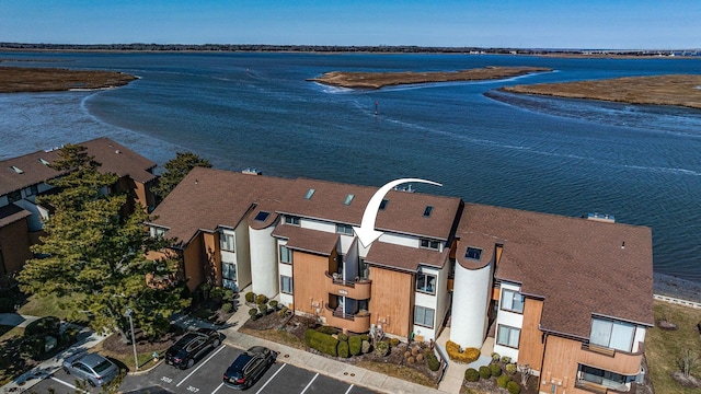 aerial view with a water view and a residential view