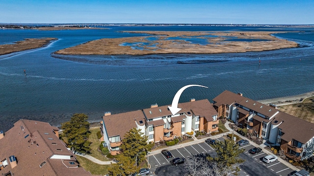 bird's eye view with a residential view and a water view