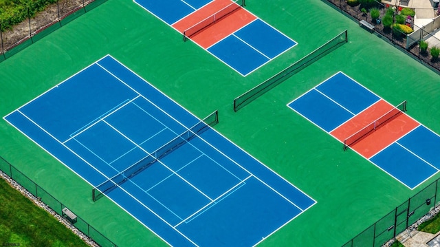 view of sport court with fence