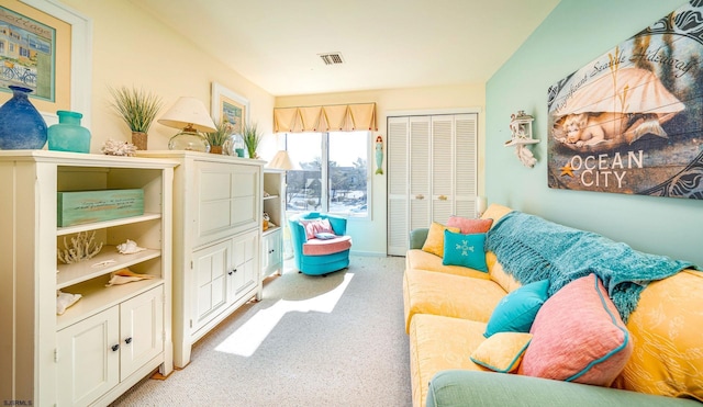 sitting room with visible vents and carpet floors